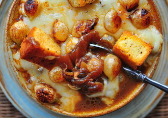 French Onion Soup rich beef broth with caramelized Pearl Onions, Swiss Cheese and Red Pepper Flake Croutons