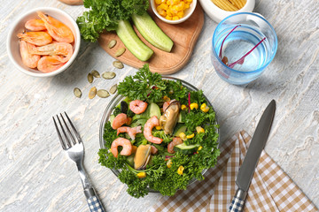 Composition with tasty shrimp salad on table