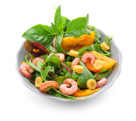 Tasty salad with shrimps and vegetables in bowl on white background