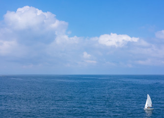 Fototapeta premium solitary sailboat in waters of the sea Cantabrico