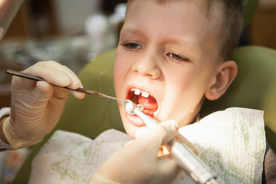 A little boy at a dentist's reception in a dental clinic. Children's dentistry, Pediatric Dentistry.