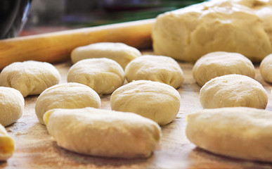 Process of preparation of patties. The filling consists of onions and eggs. Pirozhok - a dish of Russian and European cuisine from the dough with stuffing. Selective focus, copy space.