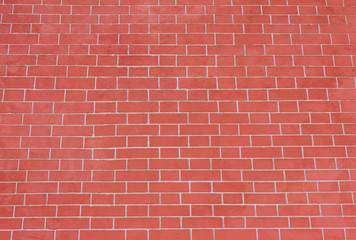 Brick Wall Pattern of Red Stone Material Background. Abstract Bright Vivid Brick Stones Pattern, Newly Built Bright Red Wall Background. Modern Vibrant Brickwall Material Surface Close Up Copy Space.