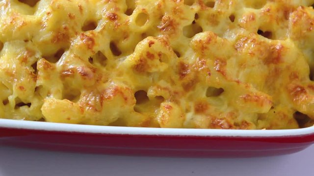 Typical American macaroni and cheese footage isolated on white background 

