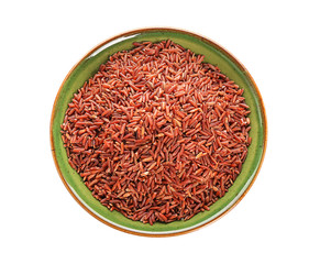 Bowl with red rice on white background