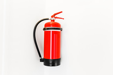 Obraz premium Red Fire extinguisher isolated on white background