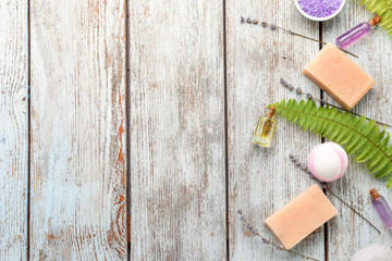 Composition with spa cosmetics and lavender on wooden table