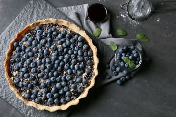 Delicious blueberry pie on table, top view