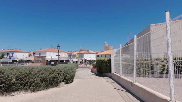 Sea resort town in the south of France Saint Marie de la Mer. The streets of the city under the hot June sun. France. Slow motion.