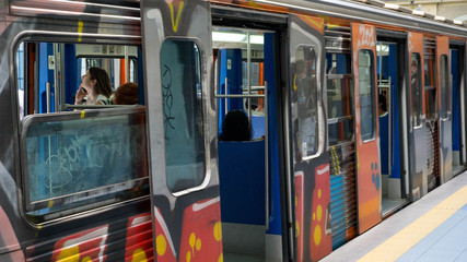 Old Train Stopping at Metro Station in Athens Piräus