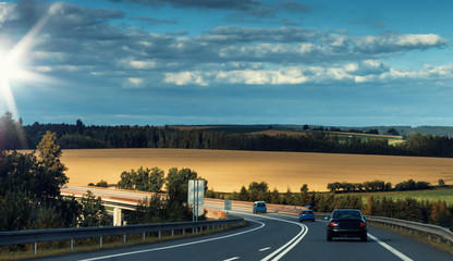 Cars on Highway Photo with Evening Sky