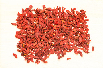 Top View Goji Berries on Light Wooden Background