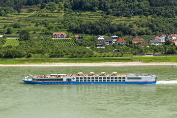 Tourist ship on the Danube river in Wachau valley.