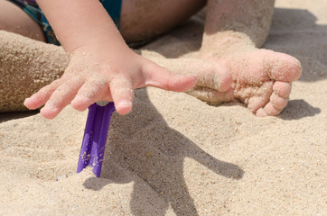 children in the sand at sea