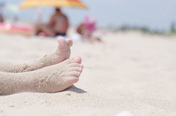 children in the sand at sea