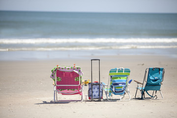 Three Beach Chairs by Ocean