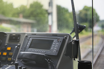 View of the railway from the driver's cab of an electric train in the summer.