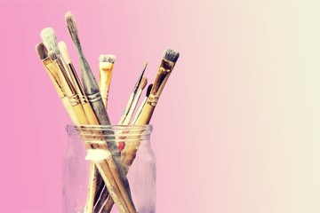 Row of artist paint brushes  on background