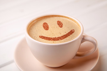 Cup of coffee with smile face on foam. I like coffee break