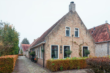 Fototapeta na wymiar The small houses in Bourtange, a Dutch fortified village in the province of Groningen