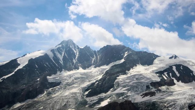 Time lapse of the Grossglockner, with the altitude of 3798 metres, the highest mountain in Austria. With the shadows from the motion of the clouds, the frozen glacier comes to life. 