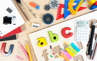 Close up of alphabet board game and basic equipment for elementary grade student for learning and playing. Wooden ABC alphabet game concept.