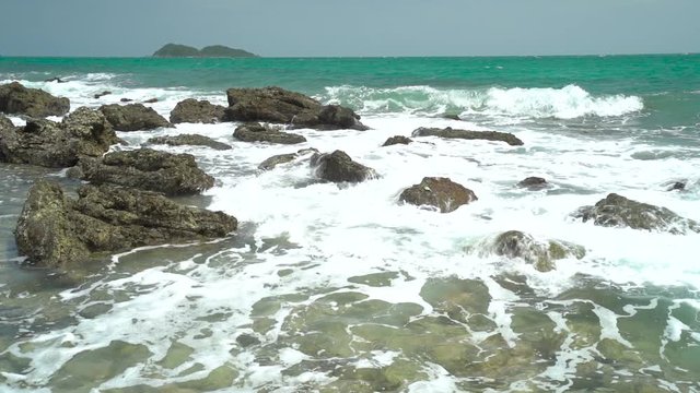 Slow Motion, Ocean wave with large wave crashing on rock