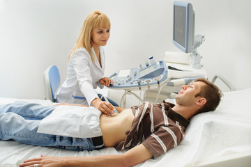 Obraz na płótnie Canvas Doctor examination a man at abdomen Usg