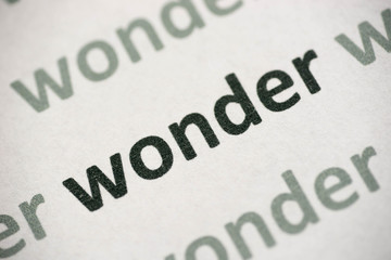 word wonder printed on paper macro