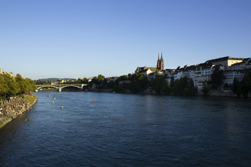 Basel with the river Rhine in the foreground and Basel's Old Town district in the background.