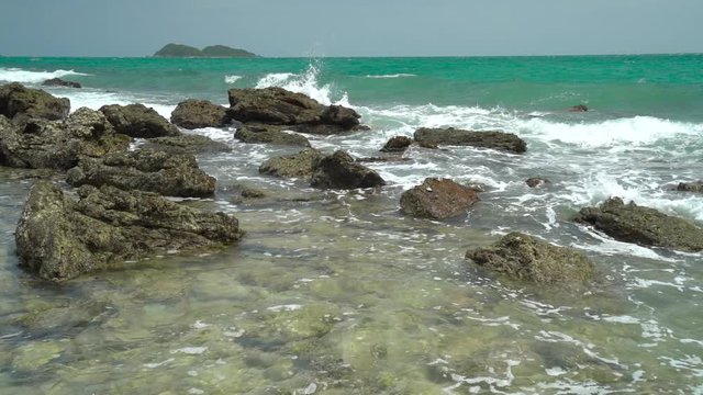 Slow Motion, Ocean wave with large wave crashing on rock
