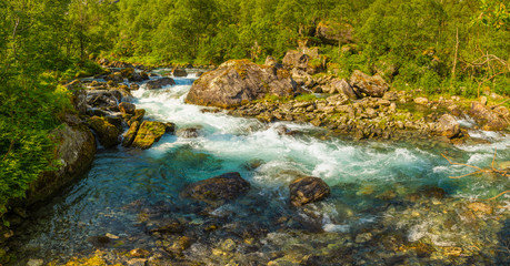 Naklejka na ściany i meble Beautiful mountain river near Trollstigen in Norway