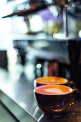 making cappuccino coffee close up detail with modern machine