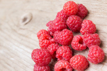Raspberries on a wooden background. Selective focus.