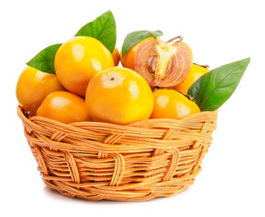 persimmon in basket on white background