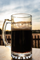 glass of beer in sunset