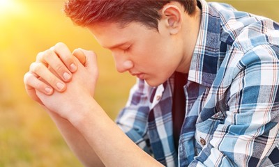 Portrait of Handsome Young man praying