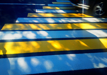 Fototapeta na wymiar Diagonal white and yellow pedestrian crossing transportation background
