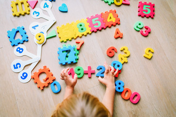 little girl learning numbers and math