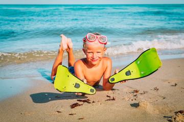 little boy with diving mask and flippers swim at beach © nadezhda1906