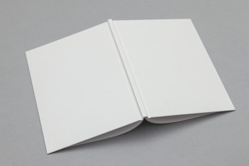 Hardback book mockup. White book on a grey background