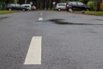 wet asphalt road with a dividing strip