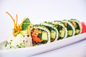 One sushi roll with carrot and cucumber