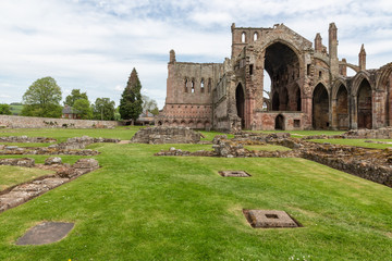 Fototapeta na wymiar View at wall and ruins of Melrose abbey in Scottish borders