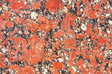 Facing material red granite texture. Natural stone red granite background texture.