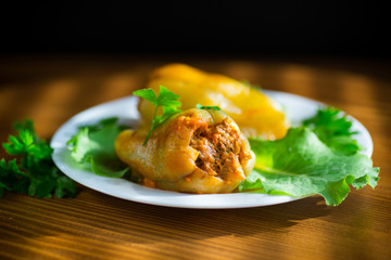 stewed in tomato sauce stuffed peppers in a plate