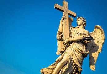 Fototapeta na wymiar Catholic angel with cross