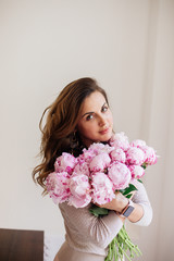 Bouquet of peonies in hands