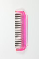 Pink colored hair brush that came with hair extensions to comb out