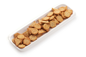 Biscuit yellow cracker, isolated on white background.